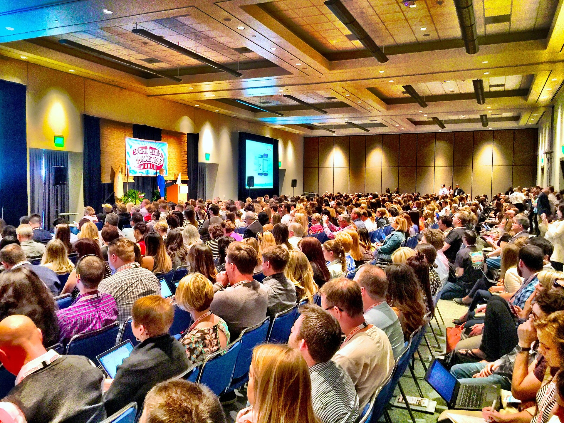 A full conference audience gathered for a live talk