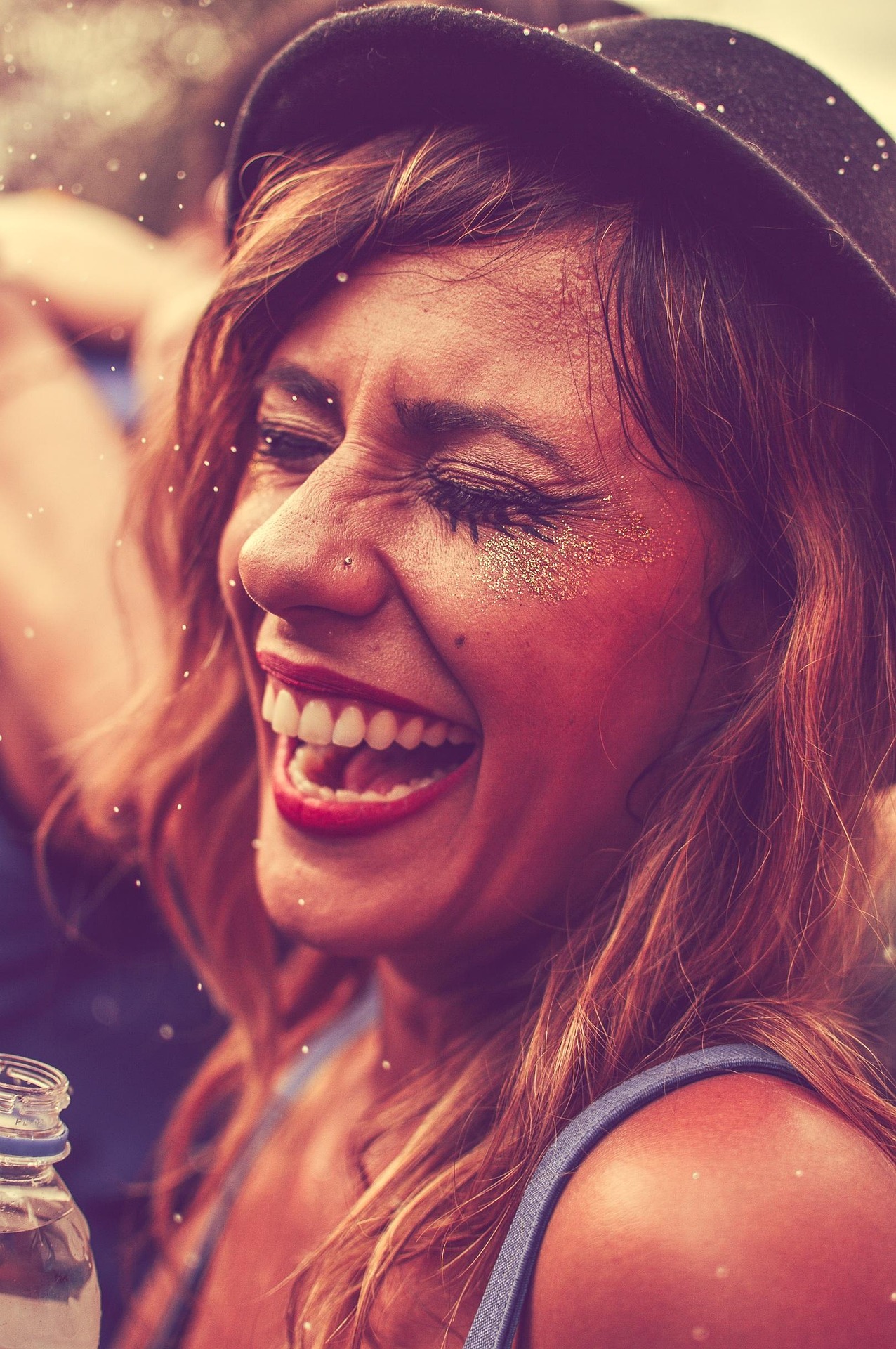 A guest laughing at a festival
